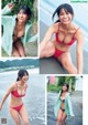 A woman in a red bikini posing for a picture.