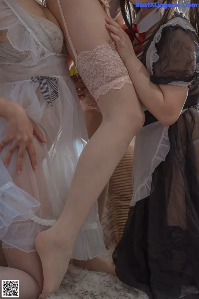 A group of women in lingerie posing for a picture.
